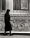 1000JG0002-01
&copy; John Gay
Elderly Lady walking with Stick in front of Iron Railing. Photo John Gay (1909-1999). London, England, c.1940