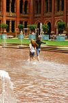 1000SC1616-01
&copy; Stuart Cox
Visitors cooling off in the pool in the John Madejski Garden of the V&A Museum. London, UK, 2006